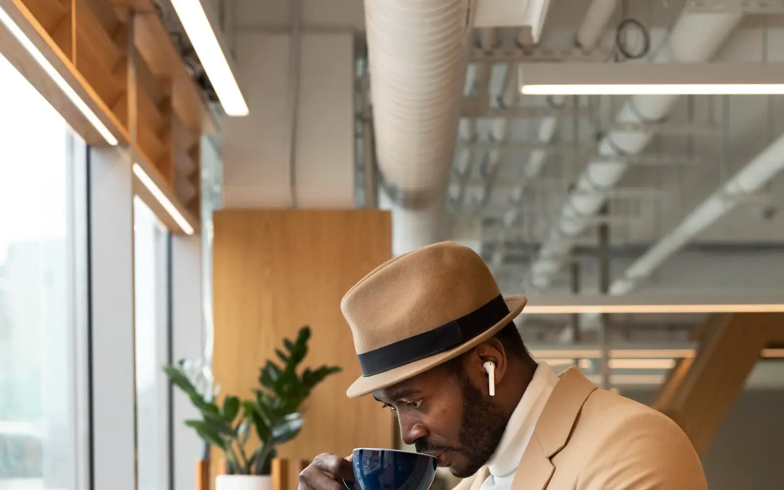 A Payclio customer managing his business from a coffee shop
