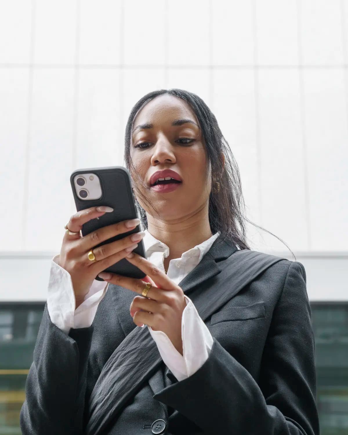 A Payclio customer checking a payment notification on her phone