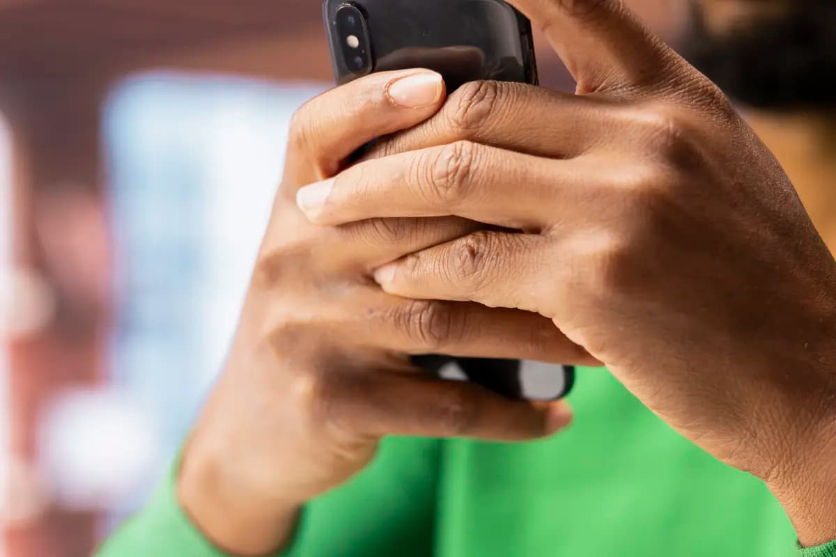 A seller sharing their payment link on social media from a phone